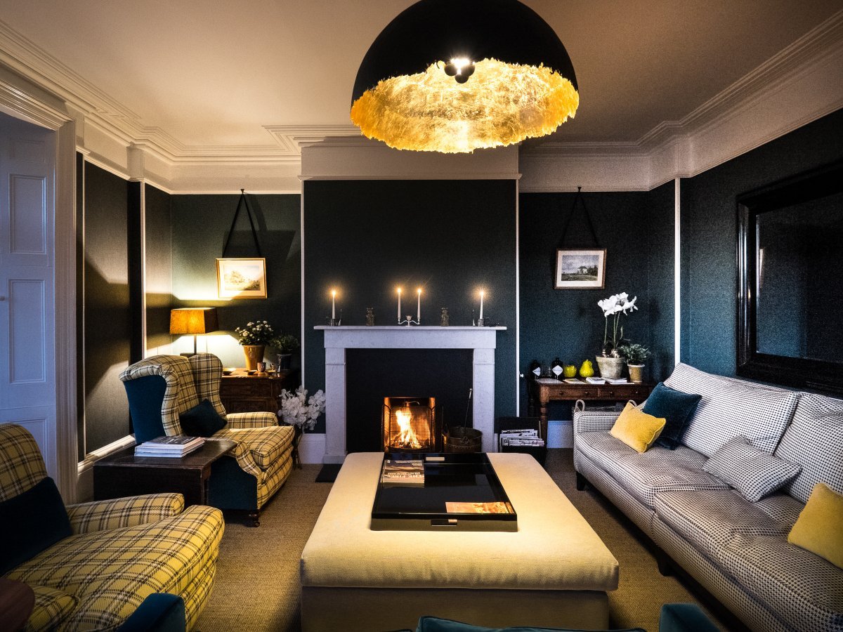 Godwick Hall and the Old Stables - luxurious drawing room with an open fire